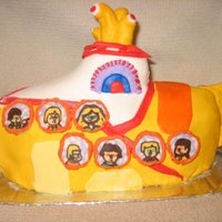 Yellow Submarine Cake This is a Yellow Submarine cake a la The Beatles for a Beatles obsessed friend. The people in the windows represent him and his friends,...