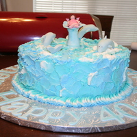 Dolphins I made this for a 40th Birthday party. It is a chocolate WASC cake with buttercream. Dolphins, fairy, water spout made of fondant. The...