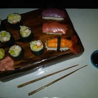 Sushi Cake Sushi board is vanilla over chocolate cake with fudge buttercream fillling; sushi is cake and fondant. Chopsticks and bowl are gumpaste,...