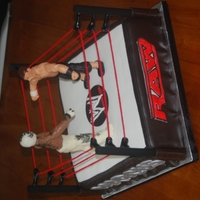 Chris And Marcus' Wrestling Cake Yellow and chocolate cake, buttercream filling, covered in fondant. The 'skirt' of the ring is milk chocolate. The poles are...