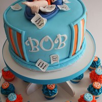 Bob Cake And Cupcakes ~ My clients ask for a figure of her husband & father floater on his pool lounge, holding his fav martini a pink cosmo, with science...