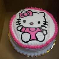 Hello Kitty 8" chocolate cake with vanilla buttercream filling, icing & frozen buttercream transfer.