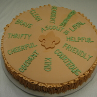 Scout Law Coin Cake One of the two cakes that I made for my son's crossover to Boy Scout. It is modeled after the coin which has the Scout Law on one side...