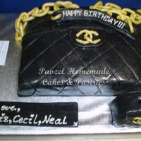 Edible Chanel Bag And Mini Purse Cake Rich chocolate cake covered with fondant icing and decorated to resemble a Chanel Bag. The candle holder is made of rich chocolate cake...