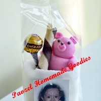 Edible Giveaways Inspired by Debbie Brown's 50 Easy Party Cakes. Everything excluding the lollipop wrapper is edible. The cake is wrapped in fondant...