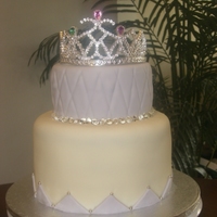 Princess 4-layer 8" and 2-layer 6" chocolate cake with cream cheese filling. Edible diamonds surround the top tier and silver dragee'...
