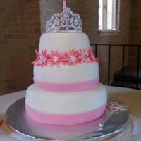 Princess Cami's First Birthday Each tier has three layers of french vanilla cake with raspberry filling. Cake is covered with MMF. Flowers are fondant too.