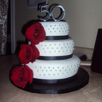50Th Black And White this cake was inspired by another on here.. its a 6,8,10 3 tiered cake. Covered in Fondant with real roses.