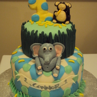Jungle Theme Birthday Cake Jungle cake made with Fondant.. and BC.. all animals and decorations are fondant