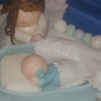 Fondant Angel Watching Over Newborn Baby I made this for my boyfriends friend who was having his son christened
