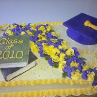 Graduation Cake Buttercream with MMF accents. I still have trouble getting the buttercream smooth. Pansies made with Royal Icing and I used a paintbrush...