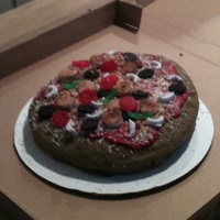 Pizza Cake Chicago style pizza cake! Vanilla cake with Oreo cream filling..fondant crust..red butter cream icing..shaved white choc. cheese..white...