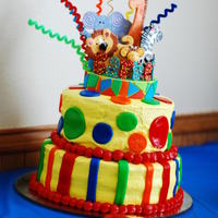 My Son's First Birthday Cake! The first cake I EVER made that was decorated! I was pretty happy with the result..and my addiction for cake decorating began... still...