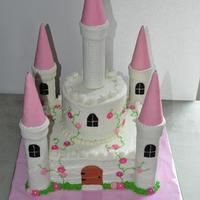 Castle Cake This is my first castle cake. I made it for a little girl's 4th birthday. 10" square and 6" circle. Turrets are paper towel...