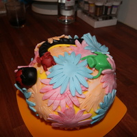 Flower Ball With Wee Beasties lemon sponge with vanilla butter-cream ,covered with fondant flowers and fondant wee beasties :) TFL