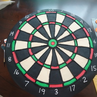 Dartboard This was made for my sister's wedding. The groom said his cake was better than hers. It is all made out of fondant.