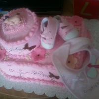 Baby And Butterflies buttercream cake with fondant flowers, butterflies and of course the baby