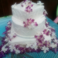 Tropical Wedding Cake Made this for outdoor Wedding. The bride had the orchids flown in from Hawii. This a pina Colada flavored cake with B/C