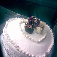 Heart Shaped Cake Vanilla cake with ganche filling with chocolate dipped strawberries.butter cream frosting. 16in. Too bad my thumb got in it