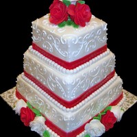 Simply Scroll 3 Tier Square. Color Scheme chosen by bride. Ivory, White, & Red with sugar roses.