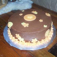 My First Birthday Cake choc. cake with choc. buttercream frosting. Fondant accents.