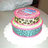 Going Back To College First time using fondent and edible paper looked better in person then on the photo was taken with a camara phone so that does not help....