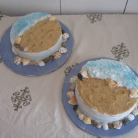 Seashore A friend got married on the beach. She asked for a beach themed cake. The shells and rocks are non-edible. Frosted with buttercream,...