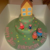 Peppa Pig Cake 9" and 5" vanilla sponge filled with vuttercream and jam. All fondant and hand done. Inspiration from newsums. Thank-you