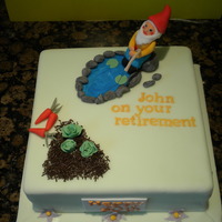 Retirement 2 x 9" square white sponge. Filled with vanilla buttercream and jam. Covered in fondant icing. All objects are free hand and made with...