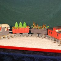Santa's Christmas Train This is my favorite cake I have ever made so far. It is a chocolate cake with butter cream and covered with modeling chocolate. I had a lot...