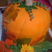 Pumpkin Cake Pumpkin spice cake with cream cheese frosting covered in fondant