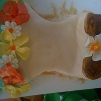 Hula Girl Pineapple cake with mango frosting covered in fondant