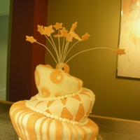 Orange Wonky Cake My second topsy-turvy cake. It's just a white almond sour cream cake with vanilla BC and MM fondant.