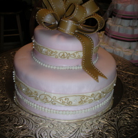 For Avonlea Homemade Strawberry cake and Lemon cake with buttercream filling. Covered in fondant. My first Fondant bow! The scroll work is buttercream...