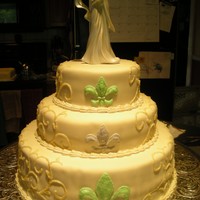 Mardi Gras Wedding My first wedding cake. Top and bottom layer are lemon and the middle is vanilla. Covered in mmf and piped with buttercream. The scrollwork...