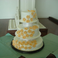 Friends Retirement Cake my first tiered cake. The flowers are gumpaste