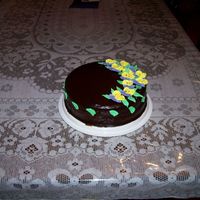 Ganache This was my first time using ganache. The flowers and leaves are royal icing.
