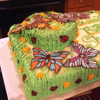 Butterfly Garden Marble cake covered in Italian Meringue Buttercream. Butterflies and lady bugs are chocolate a'la WBH chocolate method.