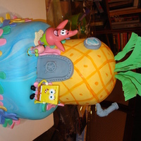 Bikini Bottom! Two Tier cake, 9" and 6" rounds, half ball on top. Figures are plastic, I decided not to do figure modeling since the cake needed...