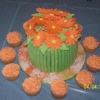 Spring Bouquet My version of the bouquet cake. Orange Gerber Daisies with matching cupcakes. Lemon cake with Lemon Buttercream filling. TFL!