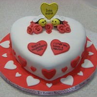 Heart Shaped Valentine's Cake 2 layer red velvet cake with cream cheese frosting covered in MMF. Bees are gumpaste.