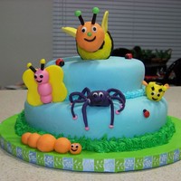 Bug A Roos This is my attempt at copying a cake found on the Wilton website. I originally made the bee to stand up but my husband said the legs were...