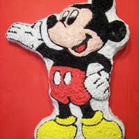 Mickey Mouse Cake A little messy but it was my first time trying out one of the shaped pans. Marble cake with regular white icing.