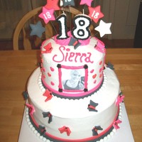 18Th Birthday Cake this 2 tier bithday cake is a 10in round and a 6in round. is covered in buttercream icing. the butterflies and stars are made of fondant....