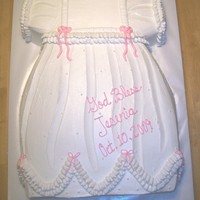 Baby Gown this gown is made from a 11x15 cake, is shaped and then iced with buttercream icing. is the decorate with piped icing for the ruffles, and...