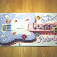 Hanna Montana Guitar Cake every little girl loves Hanna Montana, and this guitar cake is bright and colorfull. its made out of 11x15 cake and a 9x13. it s...