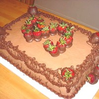 Choolate Grooms Cake With Strawberries this is a double layer, 12x18 chocolate grooms cake with chocolate butterbream, chocolate covered strawberries, and chocolate drizzle and...