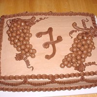 Grooms Cake With Grapes this is a 11x15 chocolate grooms cake with chocolate buttercream and fudge boarders. the grapes are made using Whoppers Malted Milk Balls,...