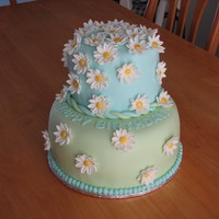 Daisy Birthday Cake I made this cake for my husband's Grandma's 80th. It is my first tiered cake with fondant and fondant daisies. Top tier is...