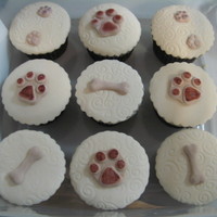 Rspca Cupcakes These were made for the local RSPCA cupcake day. they are white chocolate banana cake covered in ganache and fondant. Sorry for the bad pic...